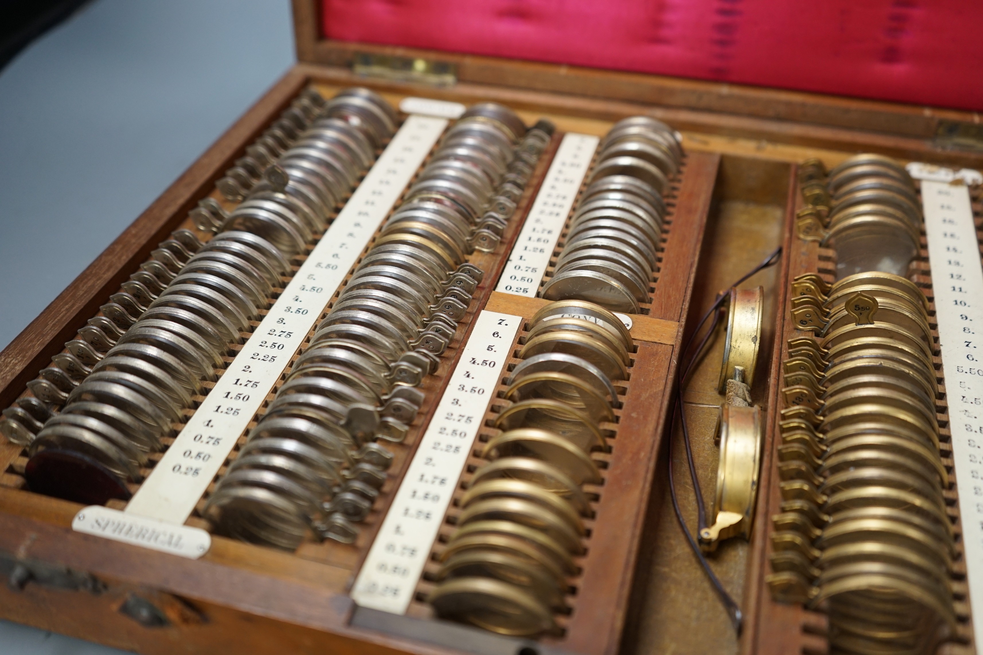 A 19th / 20th century mahogany cased optician's set, 37.5 cms wide x 29.5 cms deep